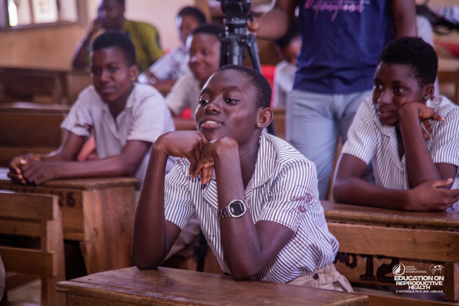 Students listening attentively during a CHAYIL school outreach session