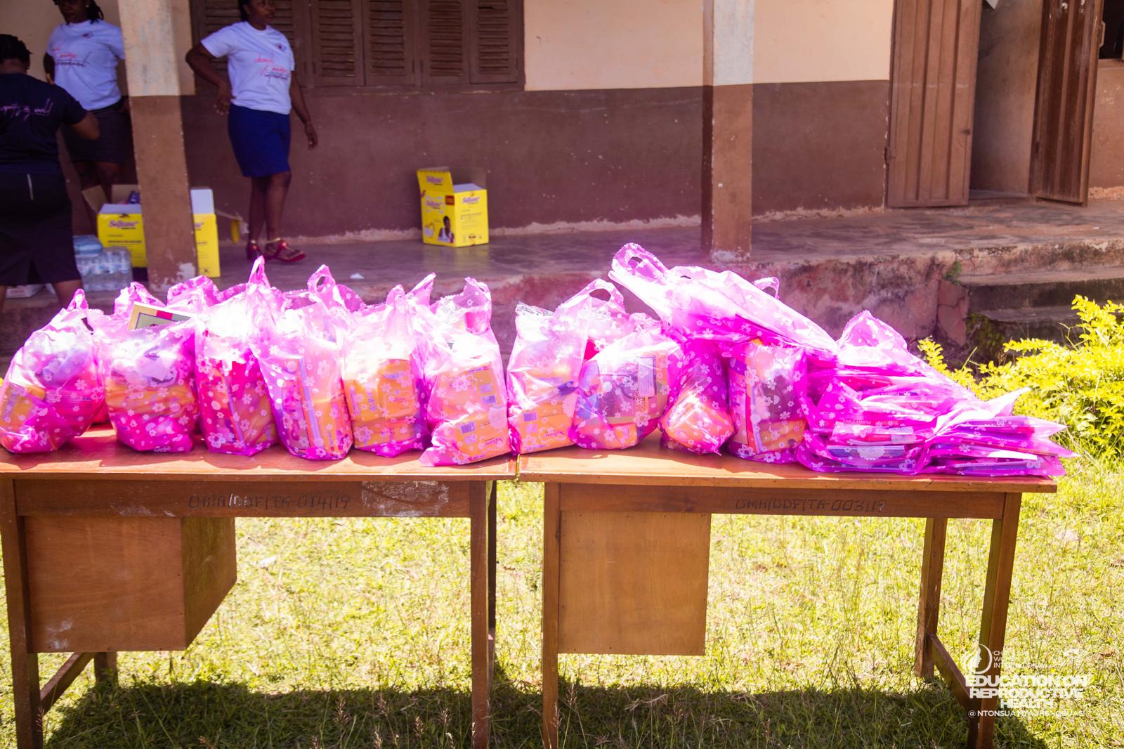 Donation bags of supplies laid out on tables ready for distribution to pupils